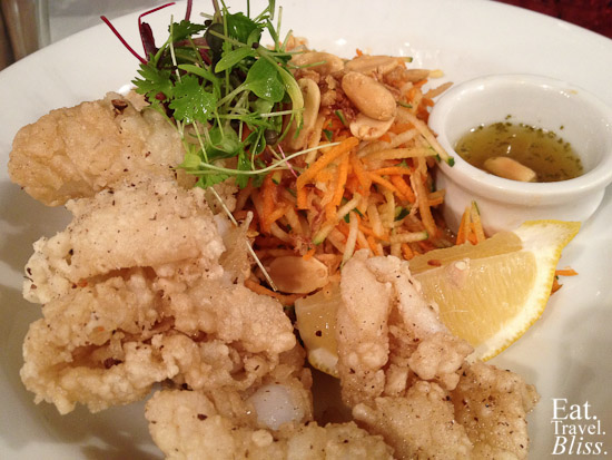 Green papaya squid salad - with Thai dressing, peanuts, and crispy fried onion